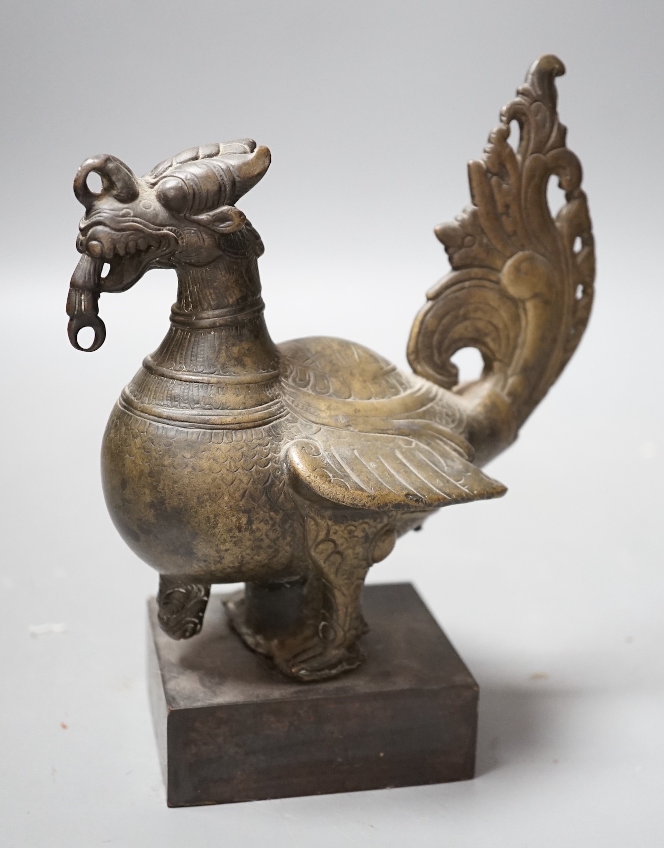 A 19th century Indian engraved bronze bird on plinth, 14.5cm wide